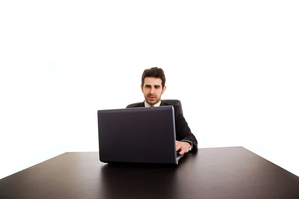 Portrait of happy business man with laptop at office desk Royalty Free Stock Images