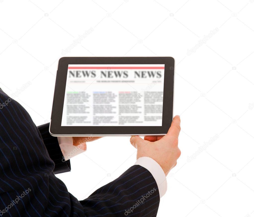 Business man holding a touchpad computer and reading the news. I