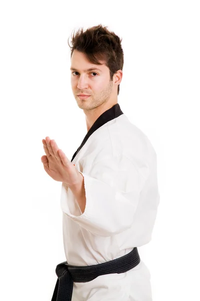 Joven en kimono ejerciendo artes marciales, aislado en blanco — Foto de Stock