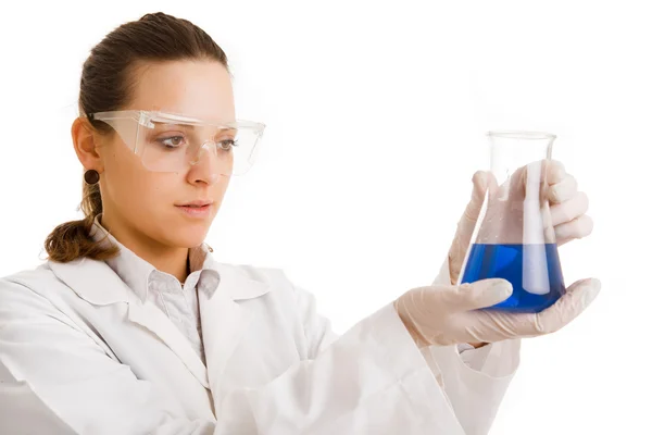 Researcher analyzing a liquid on white background — Stock Photo, Image