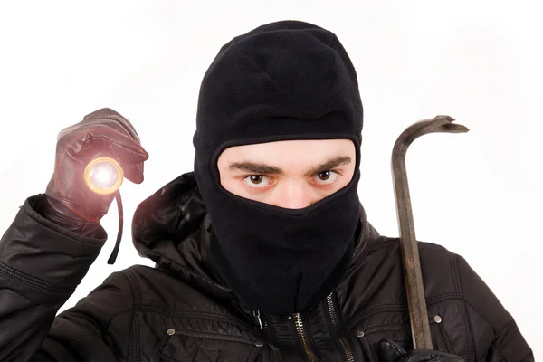 Thief with flashlight and crowbar, isolated in white — Stock Photo, Image