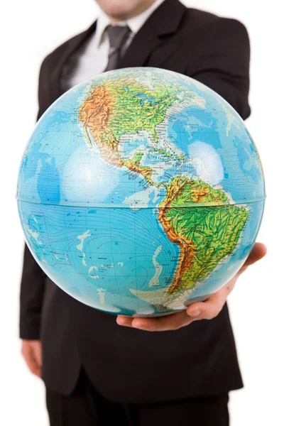 Zakenman met een globe in zijn hand, geïsoleerd op wit — Stockfoto