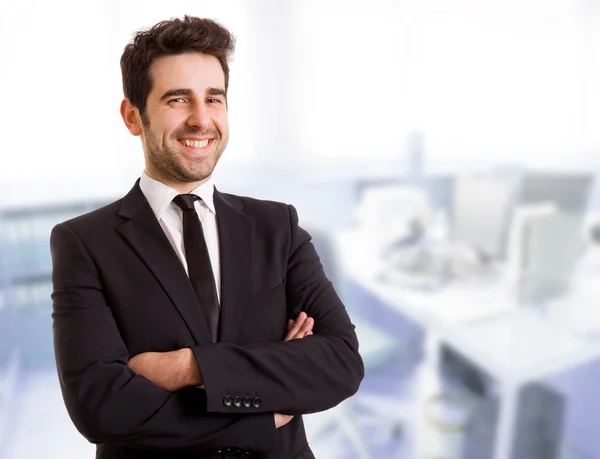 A handsome young business man at the office — Stock Photo, Image