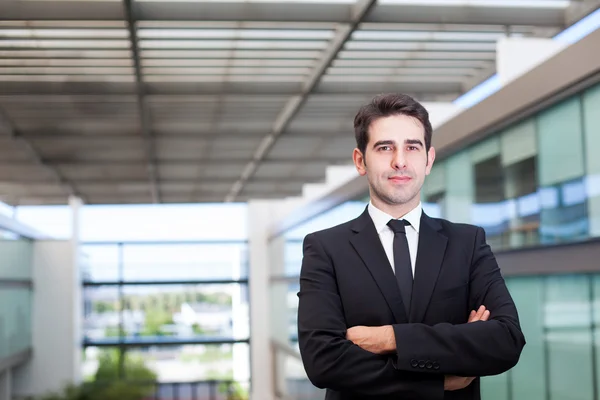 Closeup portrait of a smiling young business man at modern offic — Stock Photo, Image