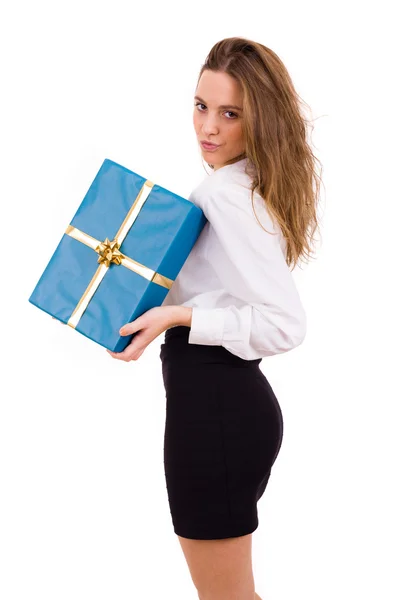 Young beautiful woman holding a gift on white background — Stock Photo, Image