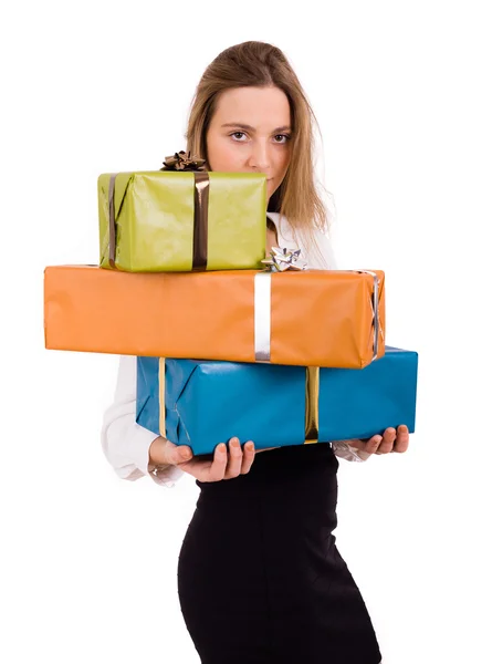 Young beautiful woman holding gifts on white background — Stock Photo, Image