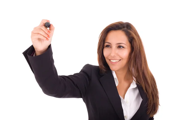 Portrait of a smiling young businesswoman drawing on white backg Royalty Free Stock Images