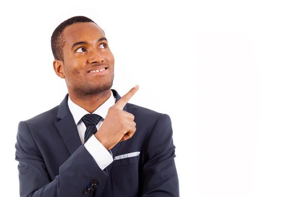 Portrait of happy afroamerican businessman pointing at copy spac — Stock Photo, Image