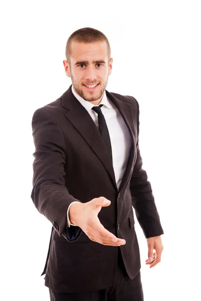 Joven hombre de negocios sonriente con la mano abierta lista para sellar un trato — Foto de Stock