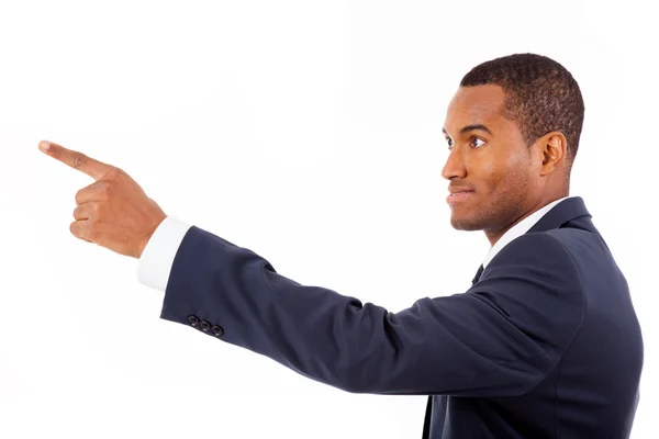 Happy African American businessman pointing at copy space agains — Stock Photo, Image