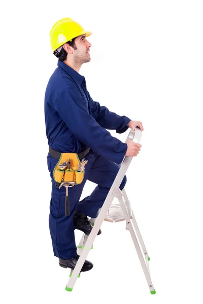 Young worker climbing a ladder, isolated on white — Stock Photo, Image