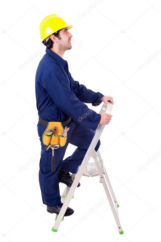 Young worker climbing a ladder, isolated on white
