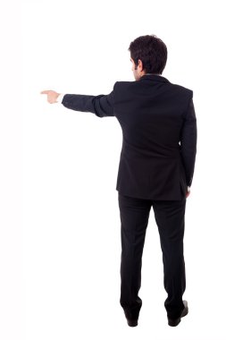 genç erkek işadamı boşaltmak üzerinde beyaz backgrou işaret eden.