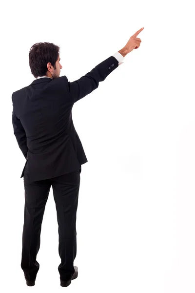 Young male business man pointing over white background Royalty Free Stock Photos