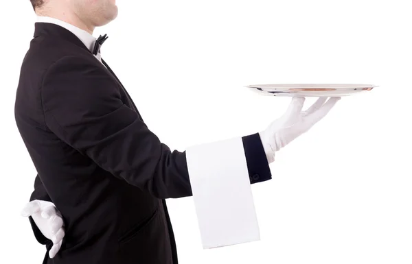 Cropped image of a young waiter holding an empty dish on white b — Stock Photo, Image