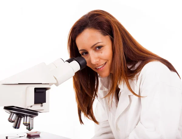 Portrait of female scientist working with a microscope, isolated — Stock Photo, Image