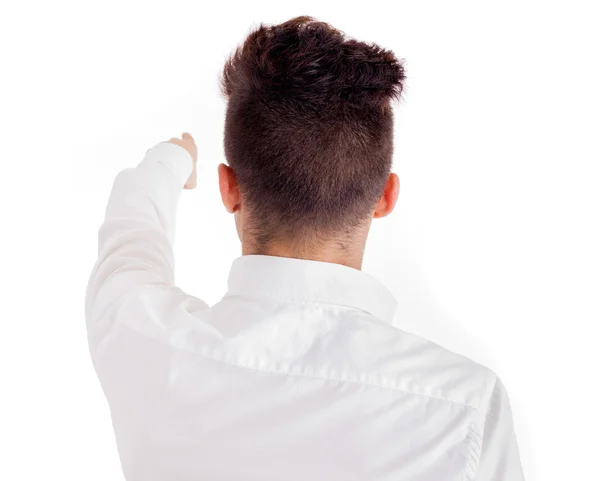 Jovem de costas apontando - isolado em branco — Fotografia de Stock