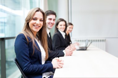 Group of business smiling at the office lined up