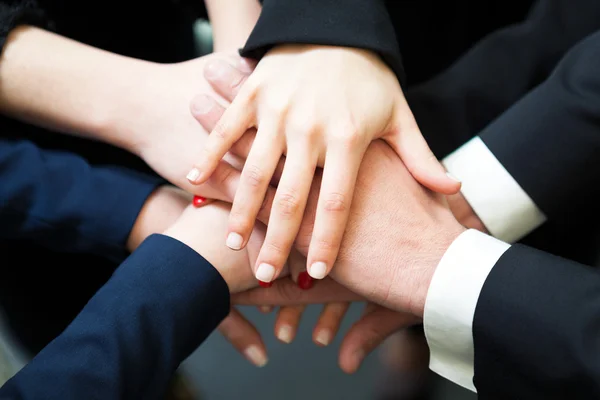 Closeup of pile of hands of business partners — Stock Photo, Image