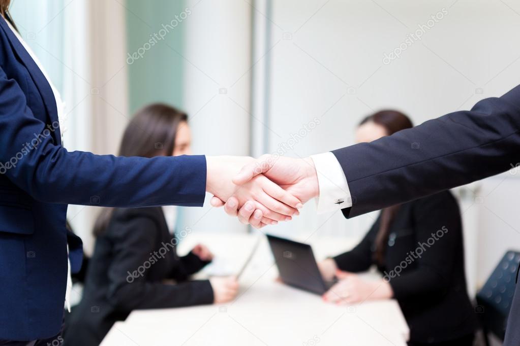 Business handshake at the office with bussiness