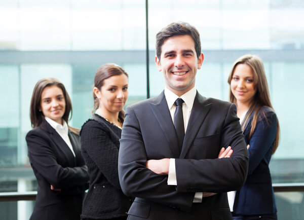 Businessman leader on the foreground of his team