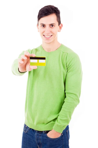 白い背景の上のクレジット カードを持つカジュアルな若者 ロイヤリティフリーのストック画像