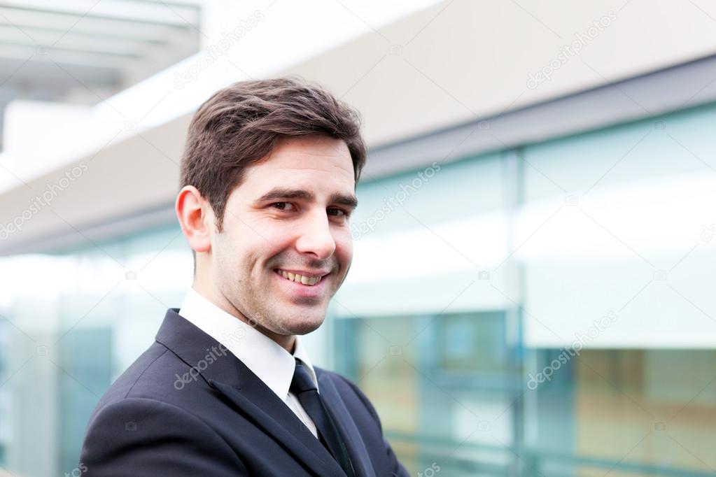 Smiling young business man portrait