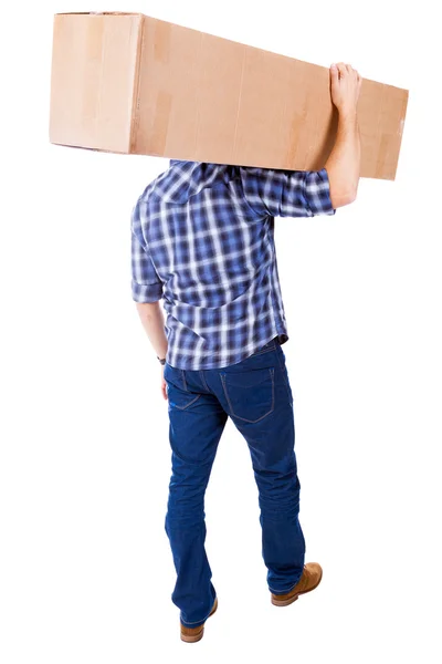 Young man carring a cardboard box, isolated on white background — Stock Photo, Image