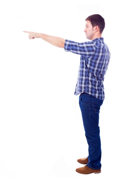 Joven hombre casual apuntando hacia el copyspace, aislado en blanco b — Foto de Stock