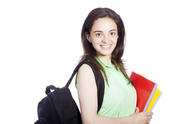 Smiling female student carrying notebooks, isolated on white — Stock Photo, Image