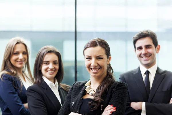 Businesswoman on the foreground of his collegues — Stock Photo, Image