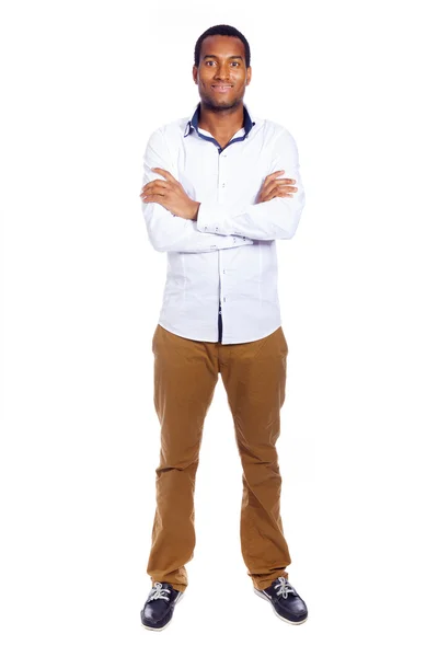 Young casual man looking at camera with arms crossed, isolated o — Stock Photo, Image