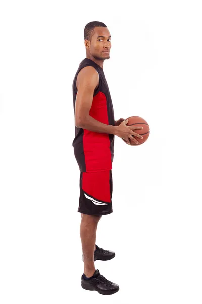 Side view of a basketball player isolated in white background — Stock Photo, Image