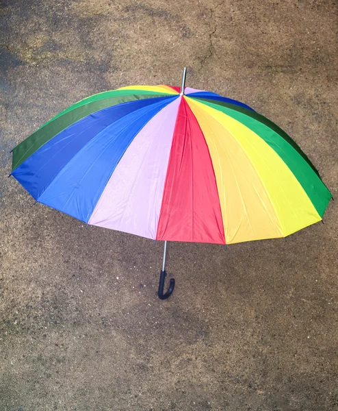 Top view of a multicolored umbrella outdoors — Stock Photo, Image