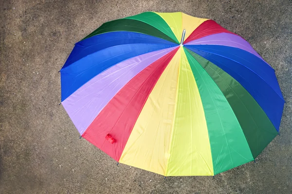 Top view of a multicolored umbrella outdoors — Stock Photo, Image