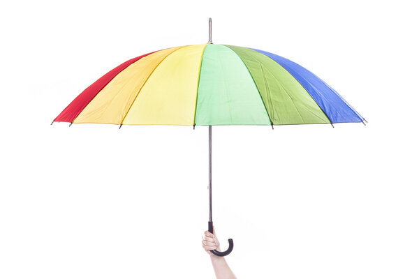 Hand holding multicolored umbrella, isolated on white