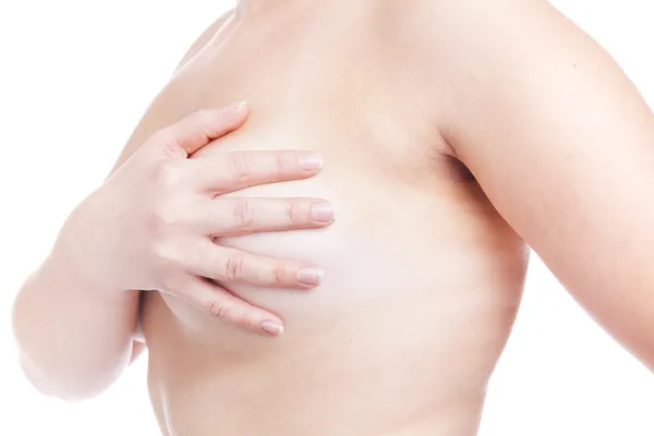 Vrouw behandeling van borst, geïsoleerd op witmujer examen de mama, aislado en blanco — Stockfoto
