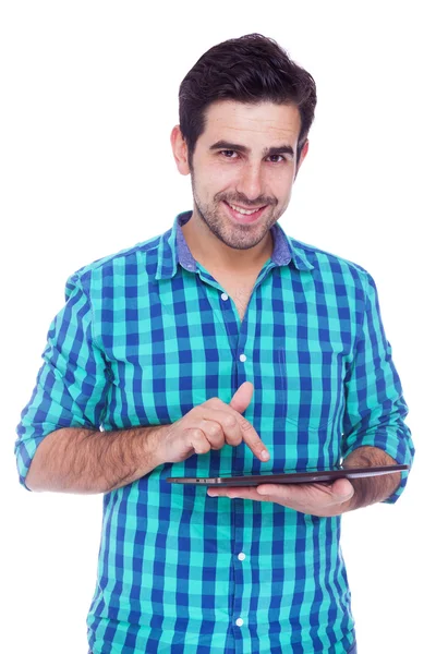 Hombre latino guapo usando una tableta, aislado sobre un blanco —  Fotos de Stock