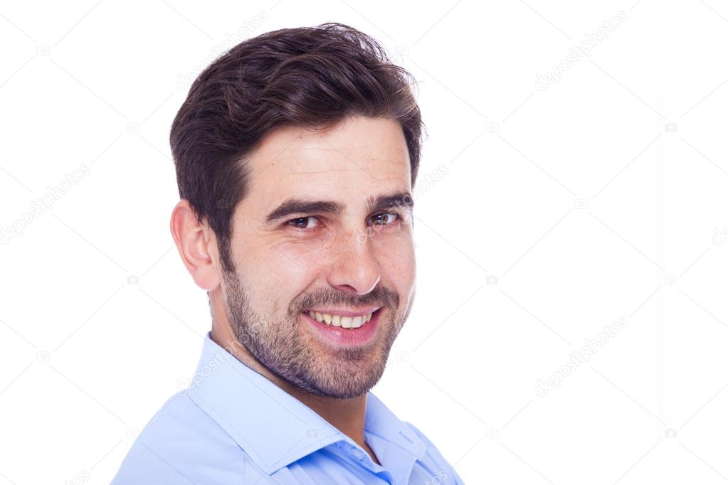 Closeup portrait of handsome latin man, isolated over a white ba