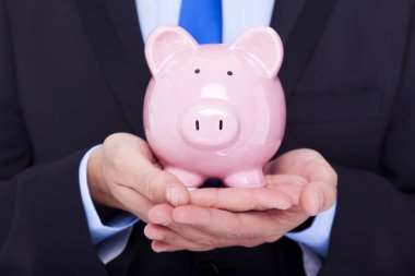 Kumbarası olan İşadamı