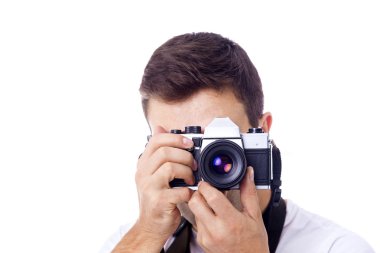 Beyaz bir arka plan üzerinde izole kamera ile fotoğrafçı
