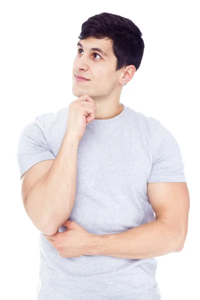 Hombre latino guapo mirando hacia arriba, aislado sobre un fondo blanco —  Fotos de Stock