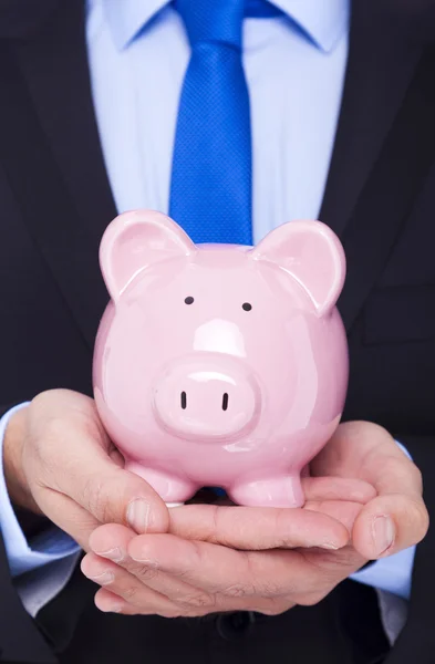 Zakenman met een Piggy Bank — Stockfoto