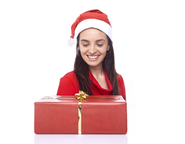 Happy Santa girl looking to a gift — Stock Photo, Image