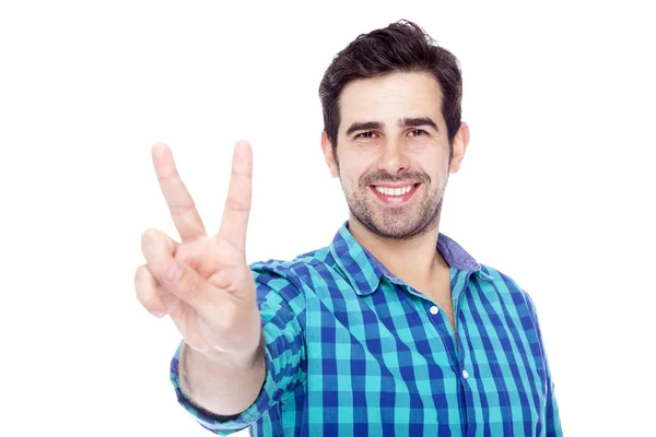 Bonito homem dando o sinal de vitória, isolado no backgrou branco — Fotografia de Stock