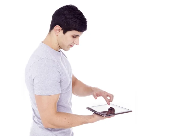 Hombre latino guapo usando una tableta —  Fotos de Stock