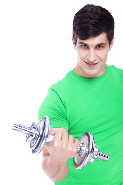 Porträt eines jungen athletischen Mannes, der Gewichte stemmt — Stockfoto