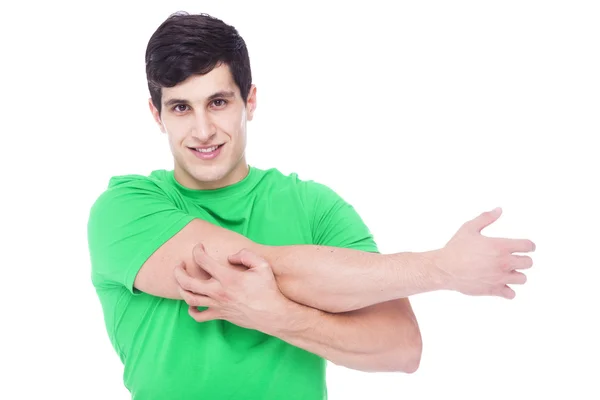 Hombre atlético estirando los brazos, aislado sobre un fondo blanco — Foto de Stock