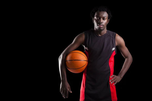 Portrait of a basketball player holding a ball — Stock Photo, Image