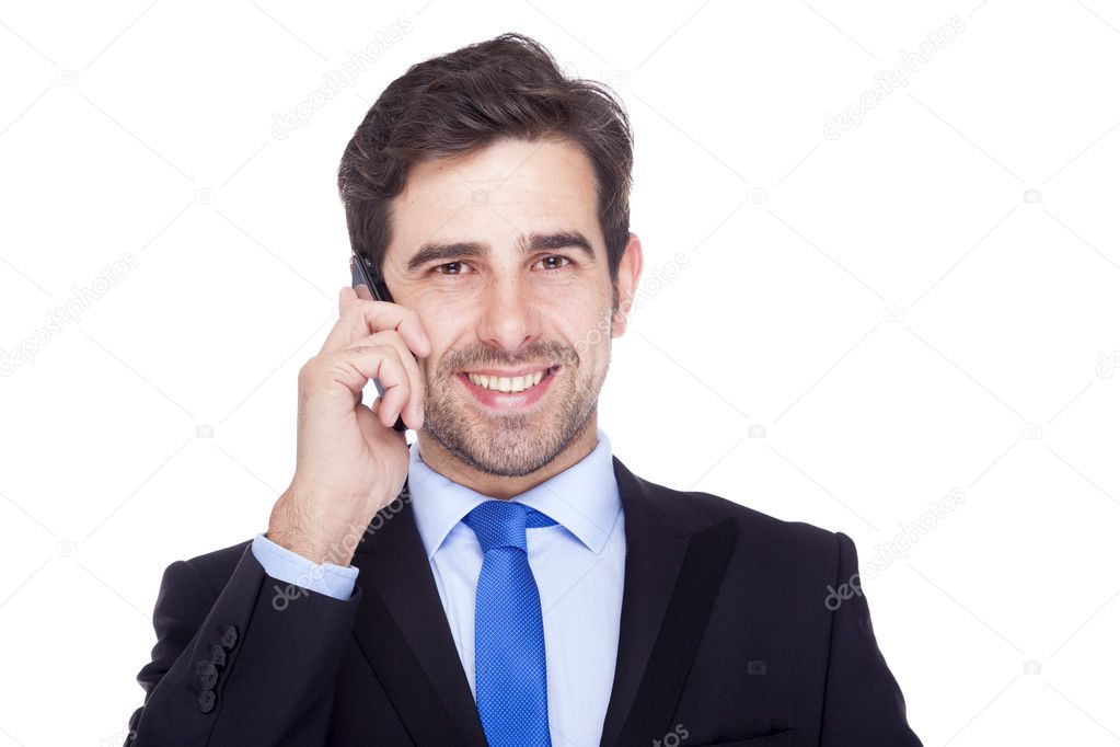 Handsome business man talking on the phone, isolated on a white